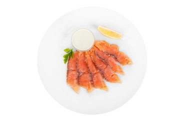Cold appetizer before alcohol, salmon fillet salted with sauce wasabi, 6 pieces, mayonnaise, sour cream, lemon slice and parsley branch on plate, white isolated background view from above For the menu