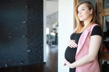 Fototapeta na wymiar Pregnant young beautiful girl on the ninth month 