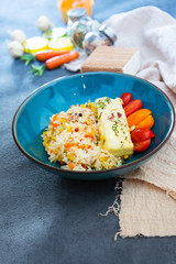 Baked salmon, vegetables and sorrel sauce accompanied oatmeal, lentil and cooked rice