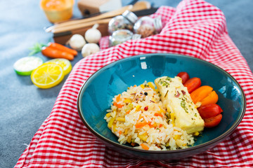 Baked salmon, vegetables and sorrel sauce accompanied oatmeal, lentil and cooked rice