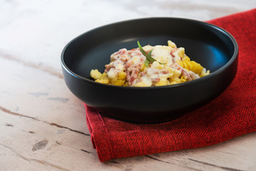 tasty pasta with roast ham on the table