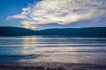river in the forest and sky on the horizon