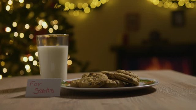 Shot of Santa taking a cookie