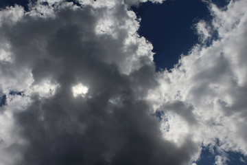 sun shining through clouds