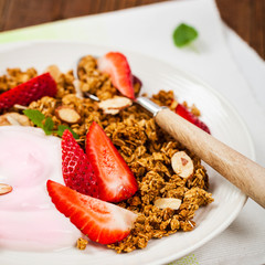 Strawberry Cinnamon Granola Yogurt Breakfast. Selective focus.