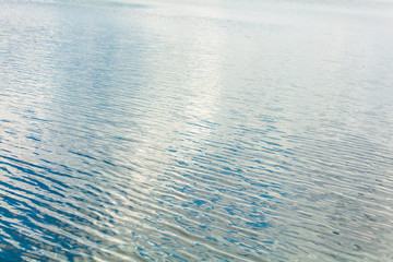 The smooth water on the lake as a background