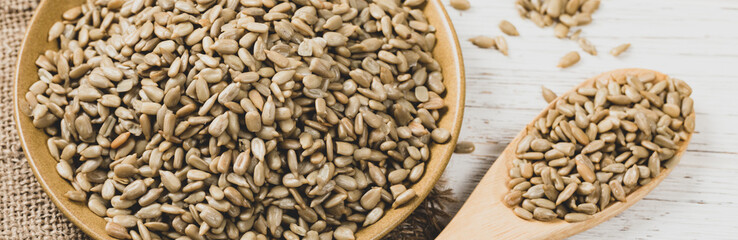 Sunflower Kernels Roasted Seeds Background. Panoramic image. Selective focus.