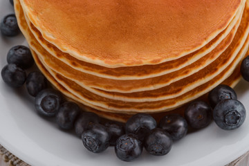 Plate with pancakes and blueberries