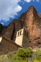 Fototapeta na wymiar Church underneath huge cliff walls in Spain