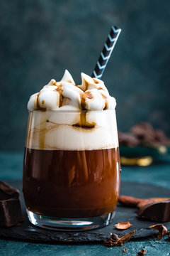 Hot chocolate with whipped cream. Chocolate dessert drink in glass