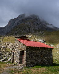 Clouds over amountain shelter in the Spanish Pyrenees