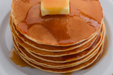 Folded pancakes with maple syrup