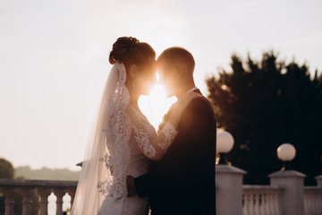 Evening walk of the newlyweds on the city embankment.
