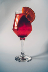 Lemonade. Citrus. Orange cocktail. Wineglass.