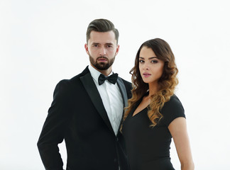 Portrait of a handsome man looking at the camera with a woman