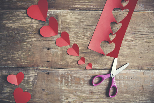scissors with heart of paper