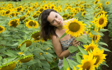 Girl in sunflowers field