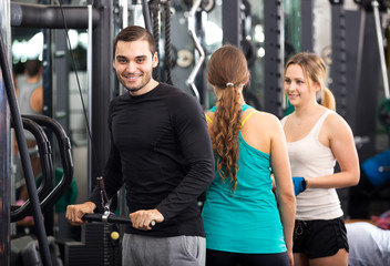 Fototapeta na wymiar Active people having weightlifting training