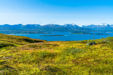 Fototapeta na wymiar Aerial view of the mountains and hills around Tromso and Tromsoysundet strait in Norway