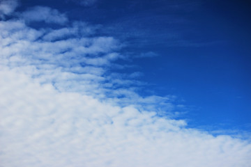 The boundary of cirrus clouds in the bright blue sky