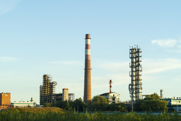 Fototapeta na wymiar industrial landscape with packed distillation columns and heating furnace in a chemical factory.