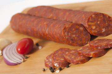 Dry pork hard salami - Hickory smoked sausage on cutting board
