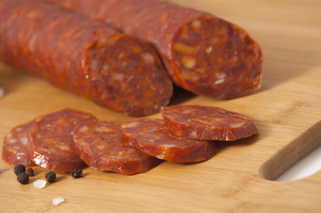 Dry pork hard salami - Hickory smoked sausage on cutting board