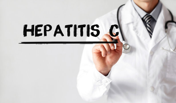 Doctor writing word Hepatitis C with marker, Medical concept