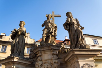 Fototapeta na wymiar Statue of Holy Savior with Saints Cosmas and Damian detail on Charles Bridge, Prague, Czech Republic