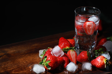Fresh ripe strawberries on a wooden table
