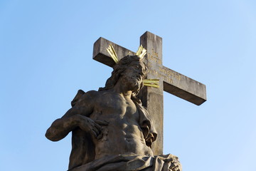 Statue of Holy Savior with Saints Cosmas and Damian detail on Charles Bridge, Prague, Czech Republic