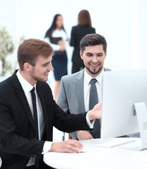 Fototapeta premium employees are talking sitting behind a Desk