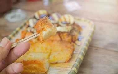 Toast topped with butter, milk, sugar. And cut into pieces