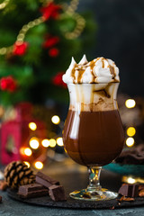 Hot chocolate with whipped cream. Chocolate drink and Christmas decorations