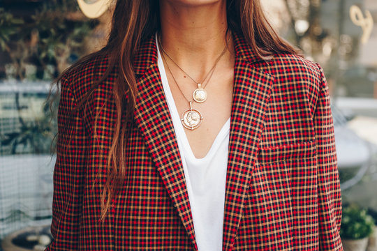fashion blogger outfit details. fashionable woman check plaid blazer, white t shirt and chunky round coin chain necklace. detail of a perfect fall fashion 2018 outfit.