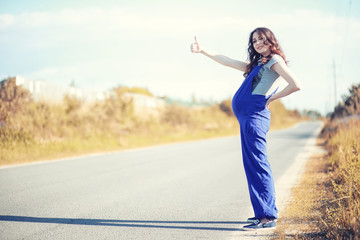 Pregnant woman hitchhiking the car