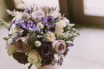 Wedding Flower Bouquet with purple coloured flowers.