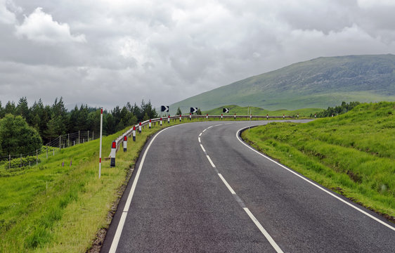 Driving Through Glencoe (the Glen Of Weeping) In The Lochaber Area Of The Highlands Of Scotland, United Kingdom, Site Of The 1692 Infamous Massacre Of The MacDonald Clan By The Campbells