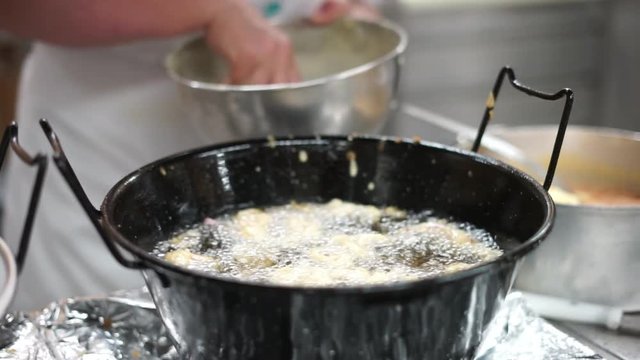 Frying rings of squid in deep oil