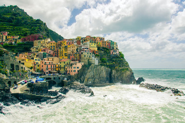 Fototapeta na wymiar Beautiful view of Manarola town. Is one of five famous colorful villages of Cinque Terre National Park in Italy.