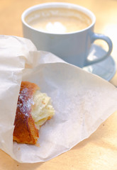 Croissant and a cup of cappuccino