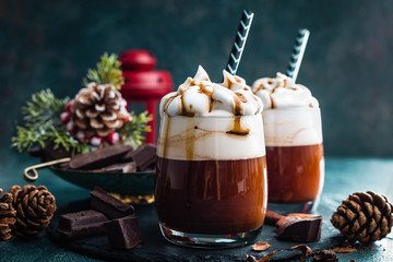 Hot chocolate with whipped cream. Chocolate drink and Christmas decorations