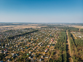 Obraz na płótnie Canvas Aerial view of nature landscape with village countryside among forest and fields, Drone photo