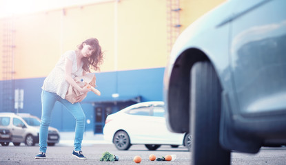 Girl with food coming out of the grocery store