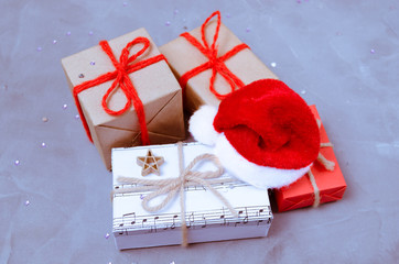 Christmas gifts and Santa's red hat.New year, winter holiday.