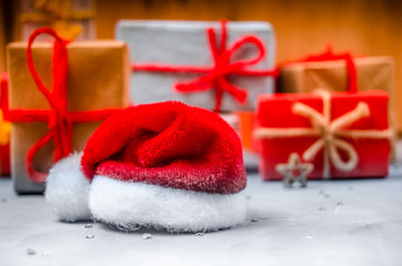 Christmas gifts and Santa's red hat.New year, winter holiday.