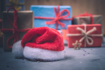 Christmas gifts and Santa's red hat.New year, winter holiday.