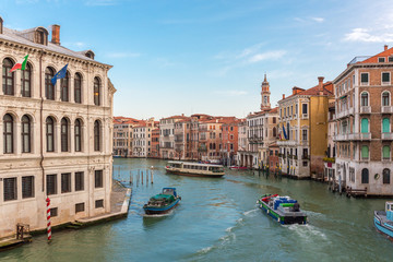 Water traffic at Grand Canal in Venice at the sunset, Italy.
