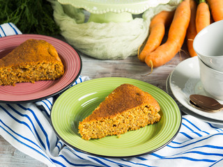 Spiced carrot cake with walnuts and cinnamon with breakfast setting background