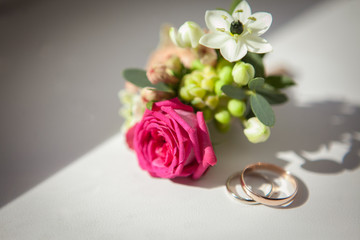 Wedding rings and boutonniere